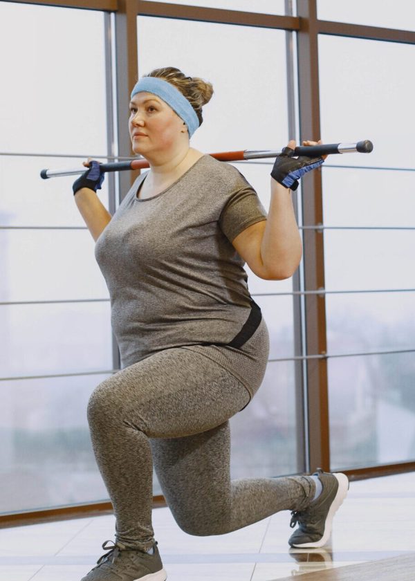 Fat woman dieting, fitness. Portrait of obese woman working out in gym.